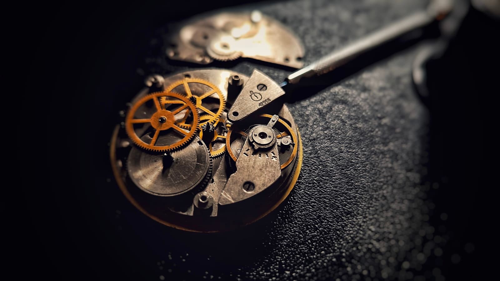 A fully restored antique pocket watch resting on a table