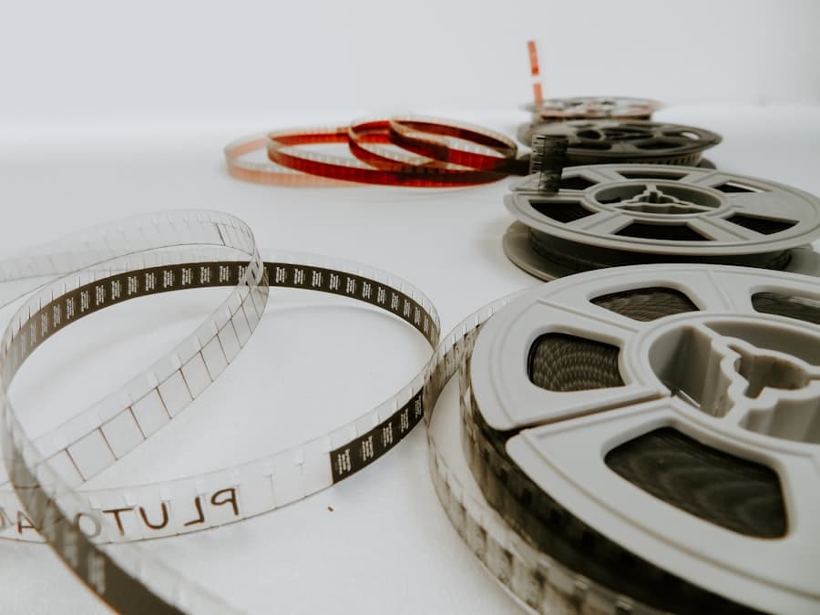 Several reels of unspooled film stock laid out on a white table